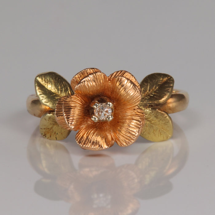 yellow and rose gold estate flower ring with diamond accents