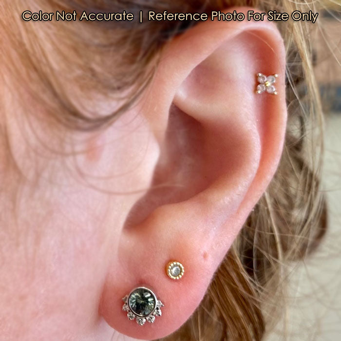 size of white gold sapphire studs on an ear