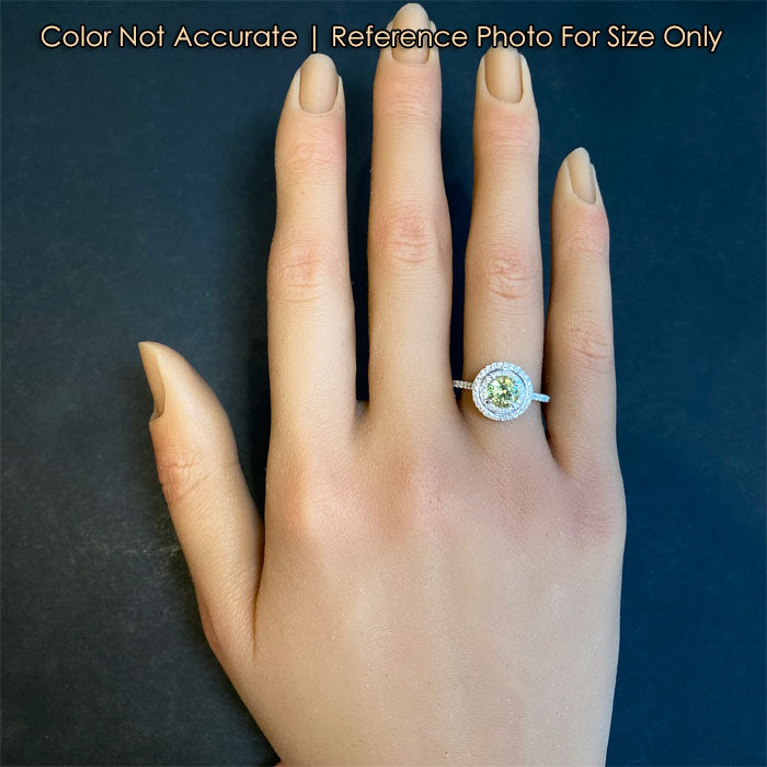yellowish green sapphire ring with diamond on hand for size reference
