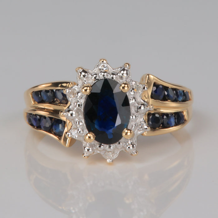 oval cut sapphire and diamond accent ring in yellow gold