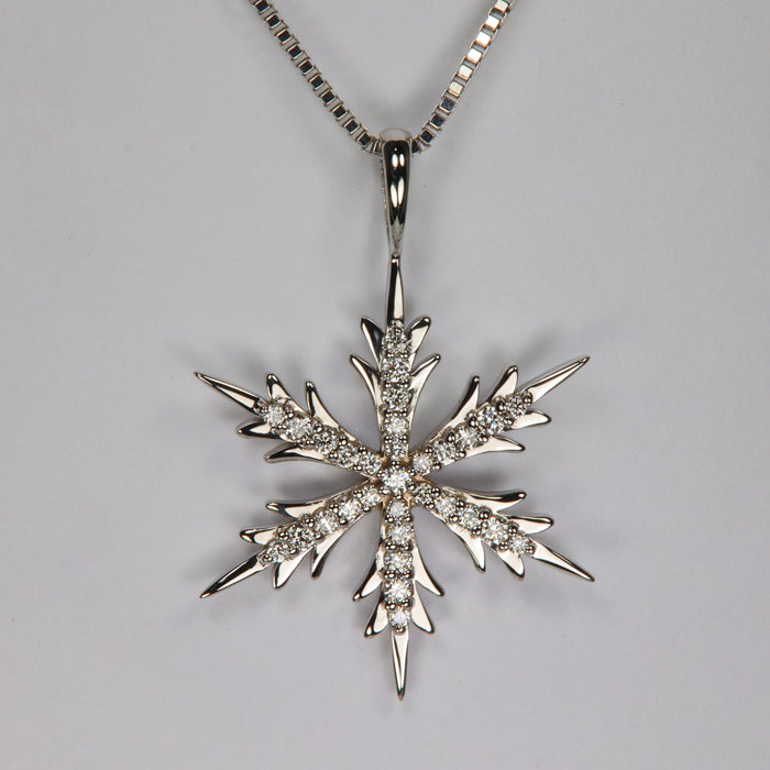 white gold and diamond pendant snowflake design