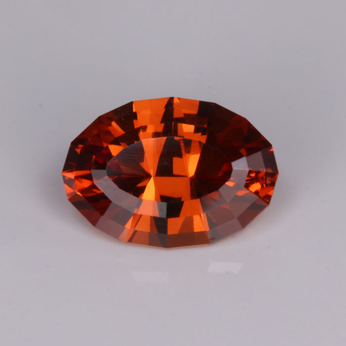 reddish orange spessartite garnet oval cut gem