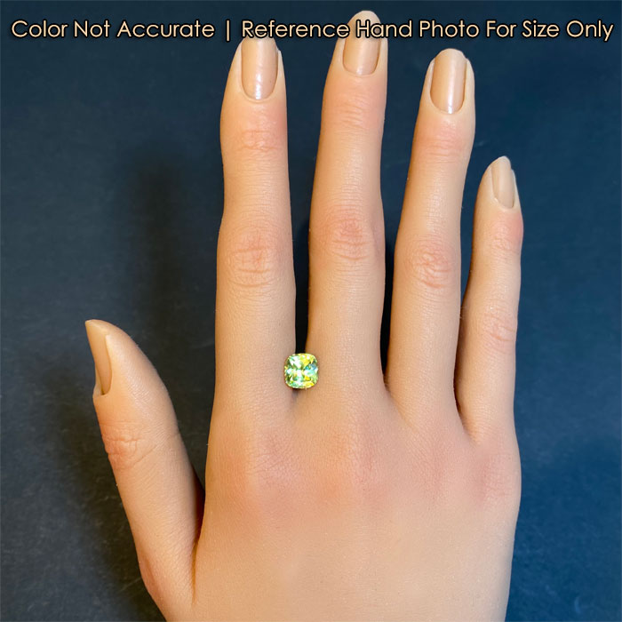 brilliant green sphene gem on hand