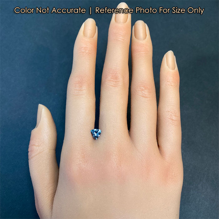 trilliant spinel on hand grey blue green