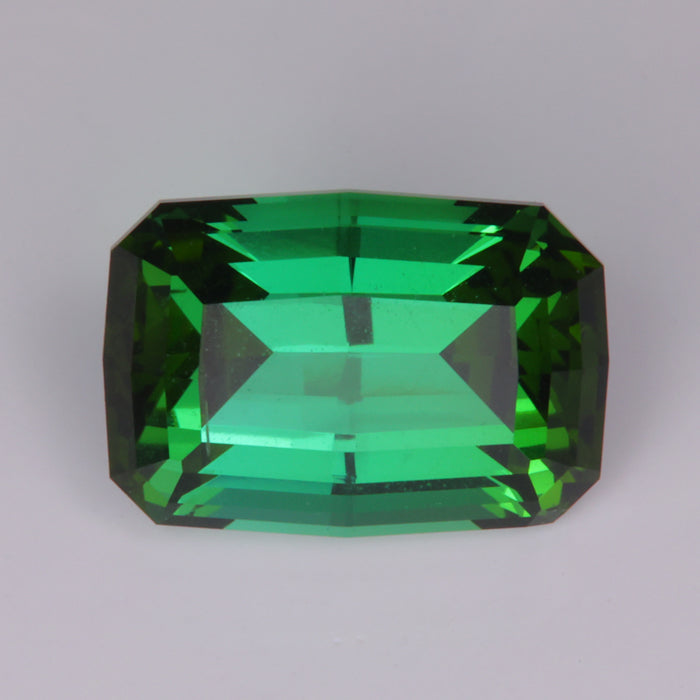 slightly blue green split facet tourmaline gemstone