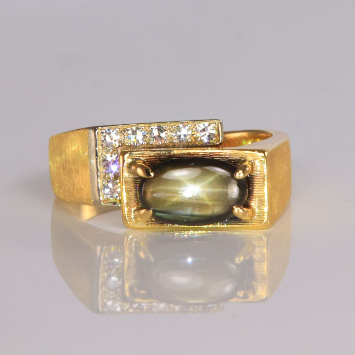 star sapphire ring in yellow gold with diamonds