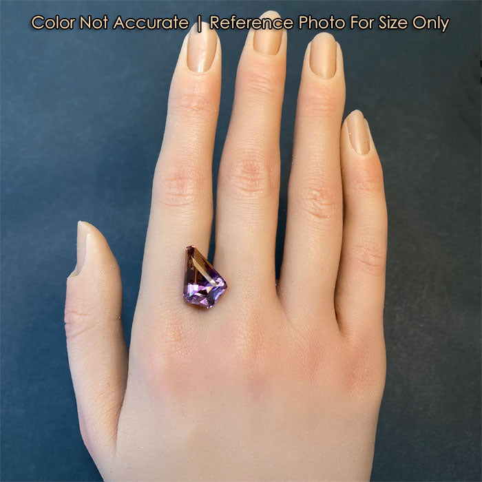 purple yellow ametrine gemstone on hand