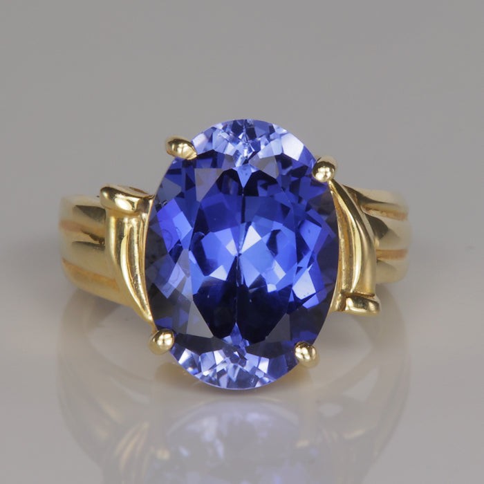 blue oval cut synthetic sapphire estate ring in yellow gold