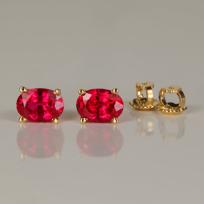 yellow gold oval cut synthetic ruby stud earrings