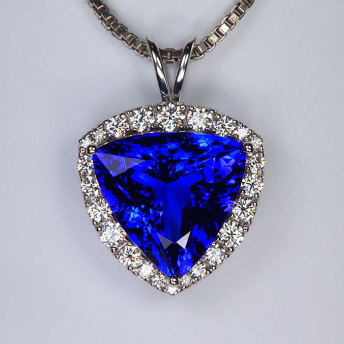 violet blue large tanzanite trilliant cut pendant white gold diamonds
