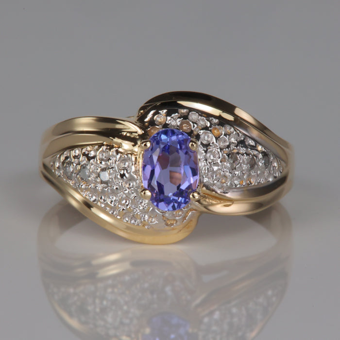 oval tanzanite and gold ring with diamond accents