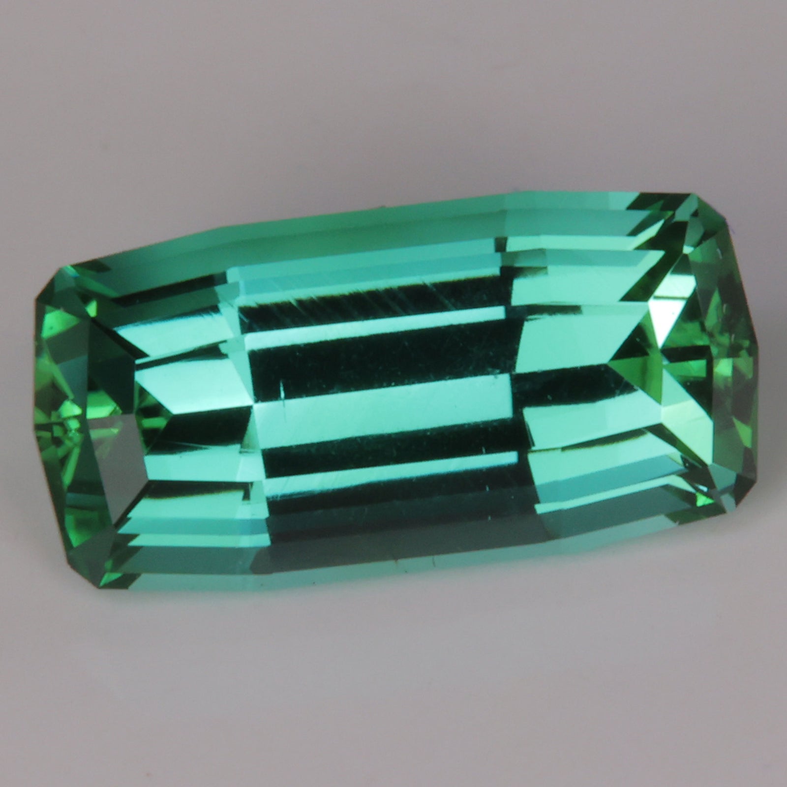 blue green tourmaline gemstone tapered baguette cut