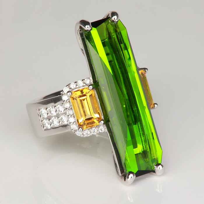platinum ring with tourmaline gemstone and heliodor with diamonds