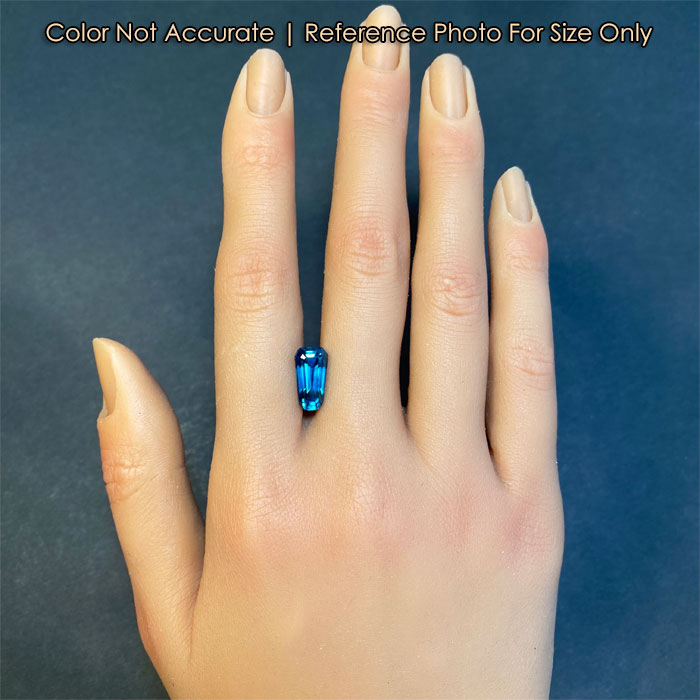 blue zircon on hand trapezoid cut