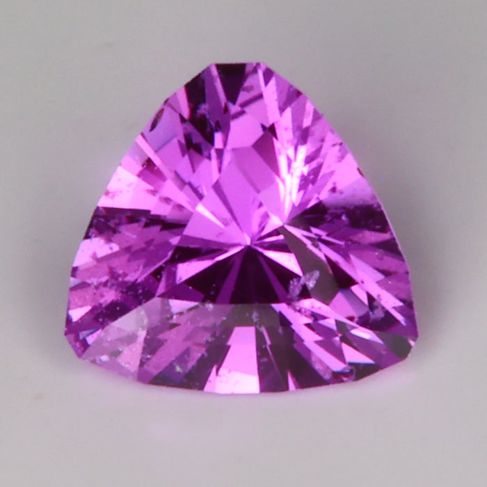 pink color trilliant cut sapphire gemstone from madagascar