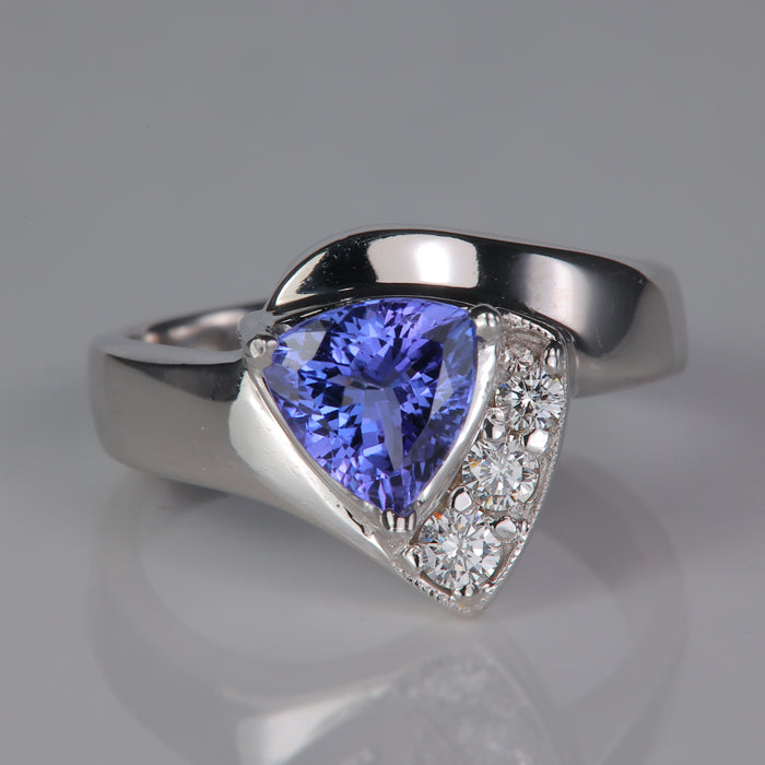 white gold trilliant cut tanzanite ring with diamonds