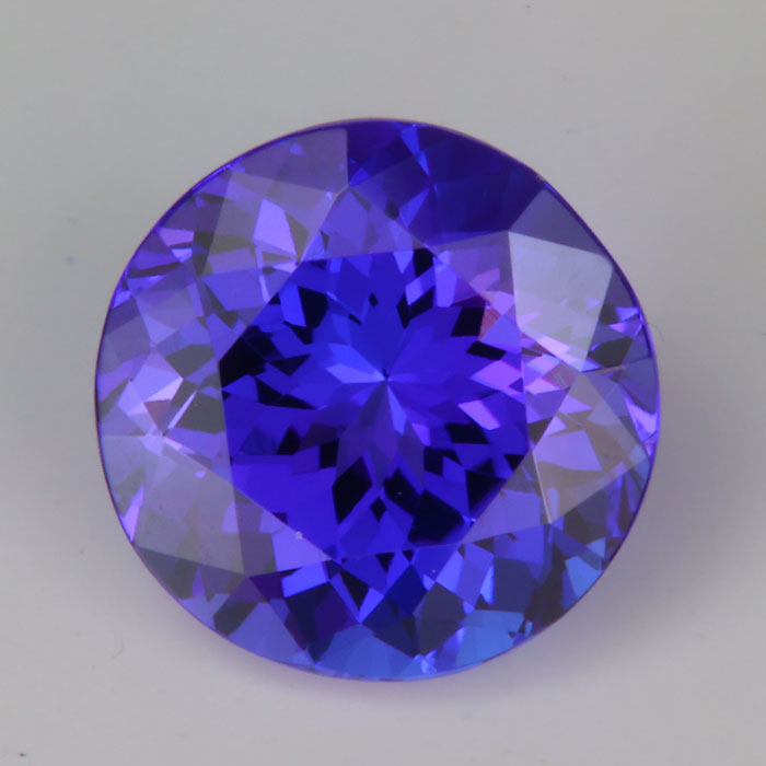 mostly violet round brilliant tanzanite gemstone