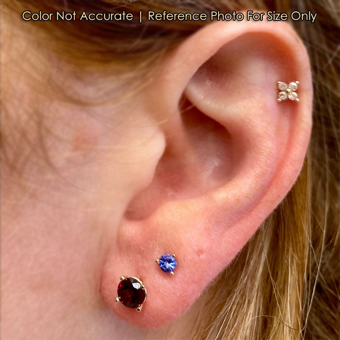 garnet stud earrings in yellow gold