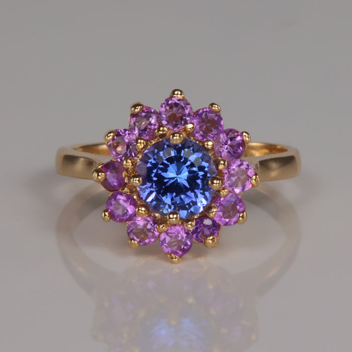 violet blue synthetic tanzanite and purple amethyst gemstone ring in yellow gold