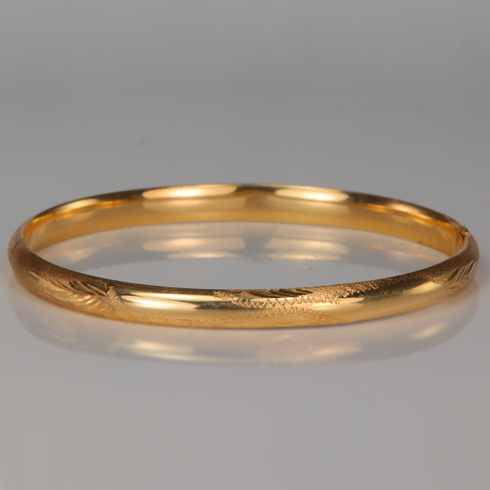 Gold bangle with design