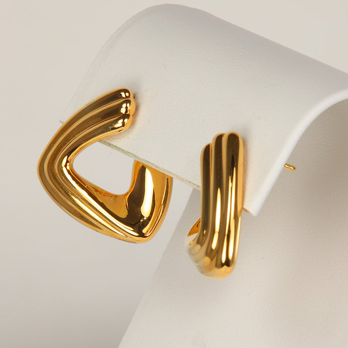 gold earrings with puffy triangle design