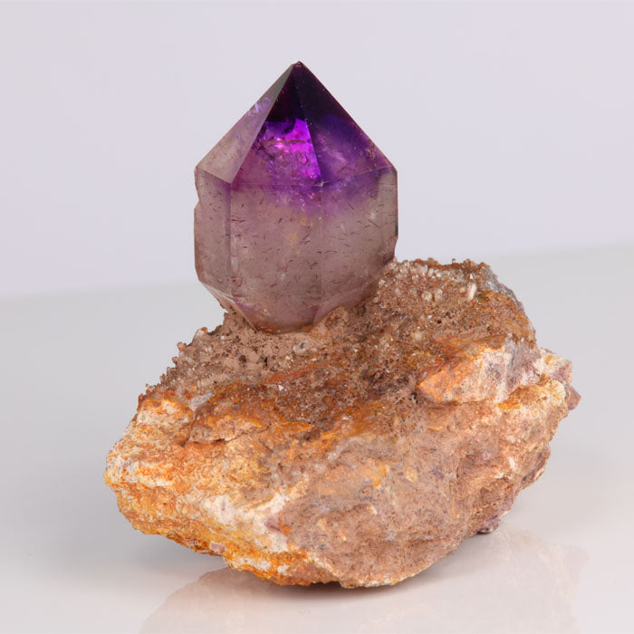 amethyst crystal on host rock
