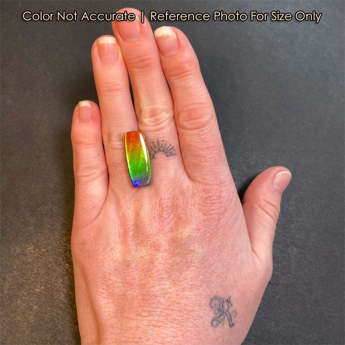 size of antique cushion ammolite to a hand