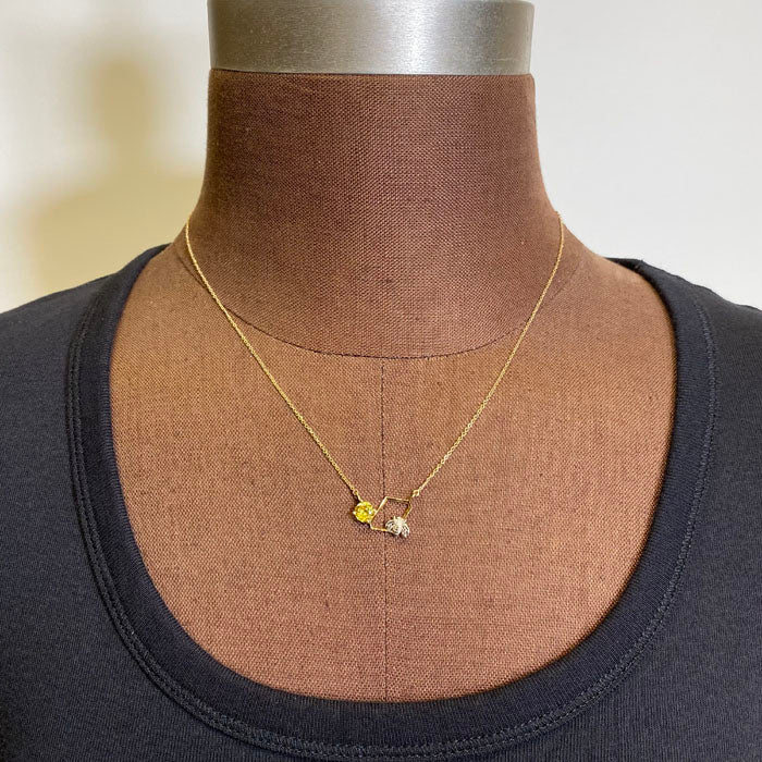 bee and sphene necklace yellow gold