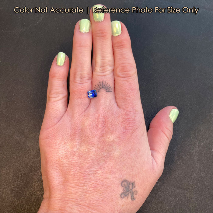 size of blue and clear sapphire on hand