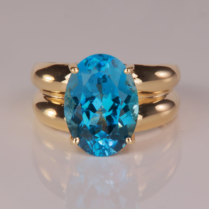 greenish blue topaz ring in yellow gold