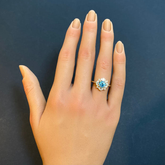 blue zircon and diamond ring in yellow gold