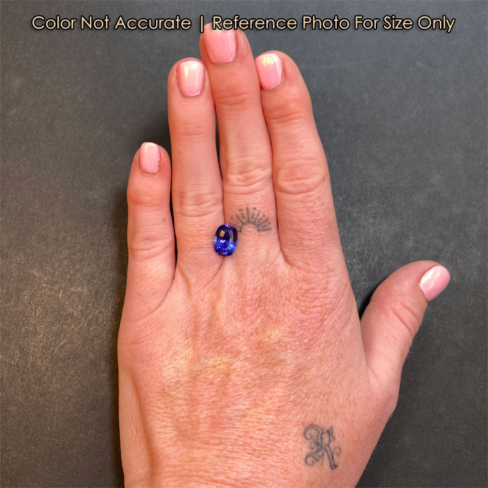 violet blue tanzanite gemstone size to hand