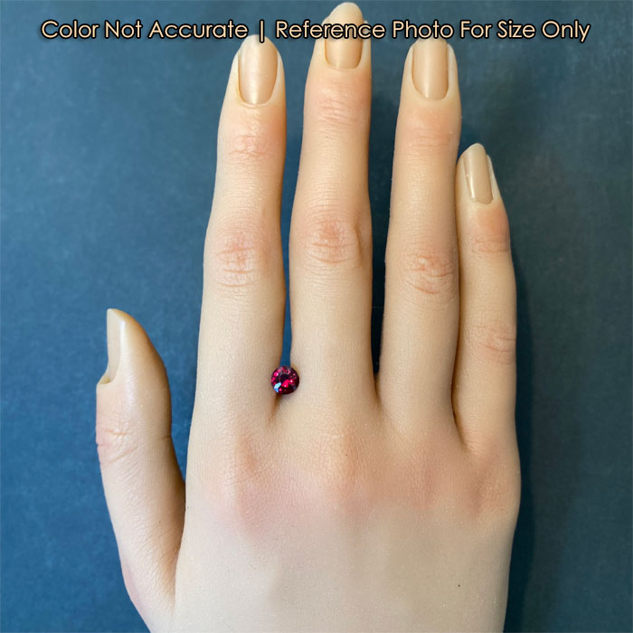 red color round brilliant chrome pyrope gemstone on hand