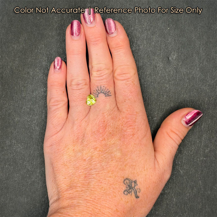 heart shape chrysoberyl gem on hand