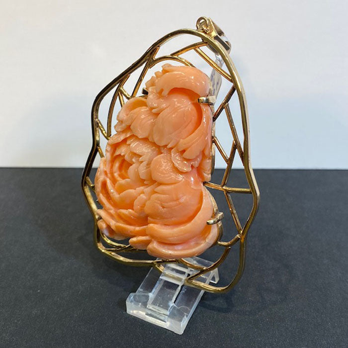 handcarved coral and gold pendant