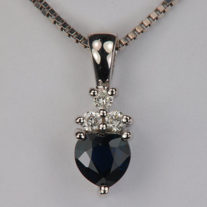 heart shape deep blue sapphire pendant in white gold with diamond accents