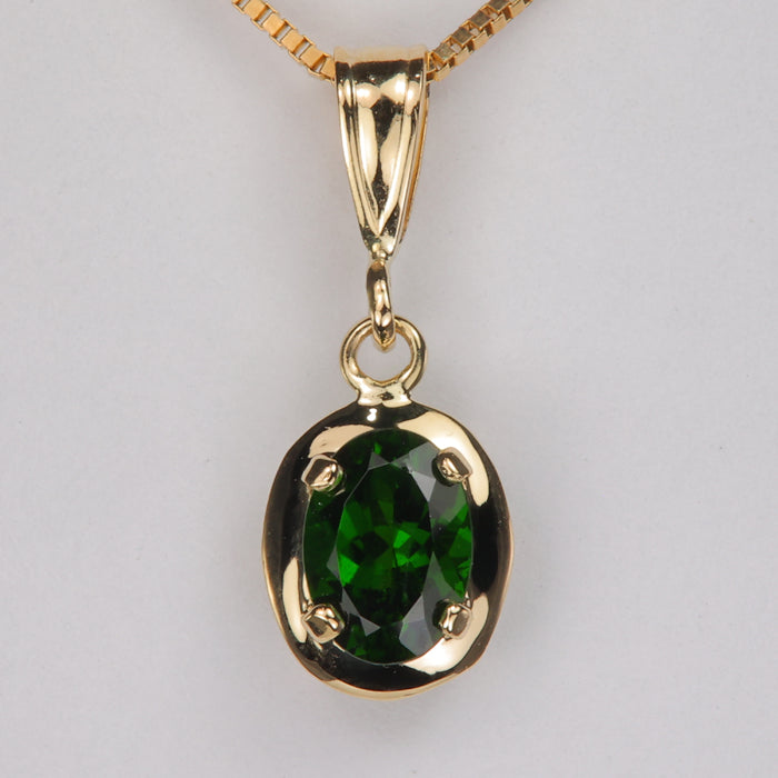yellow gold pendant with deep green tourmaline gemstone