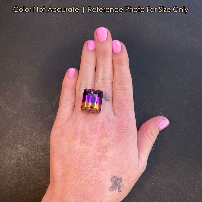 purple and golden yellow ametrine on hand