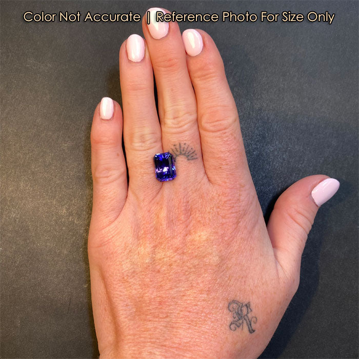 tanzanite gemstone emerald cut on hand size