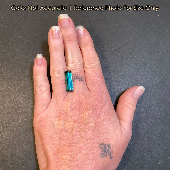tourmaline greenish blue gem size to a hand