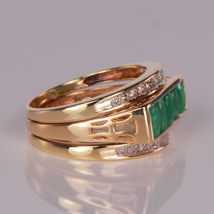 estate ring with yellow gold and emeralds