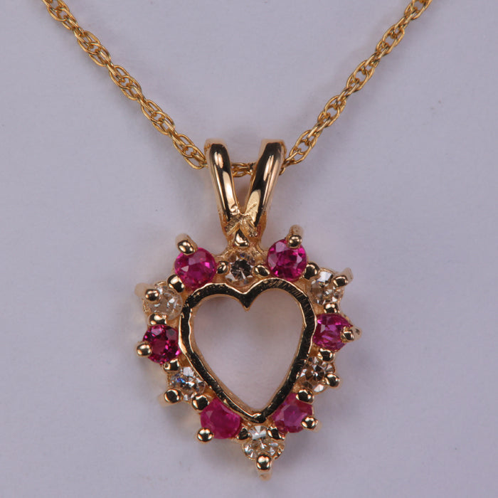 ruby and diamond yellow gold heart shape necklace
