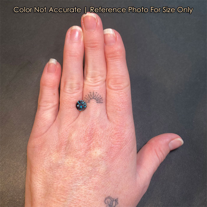 sapphire on hand size greenish blue round cut
