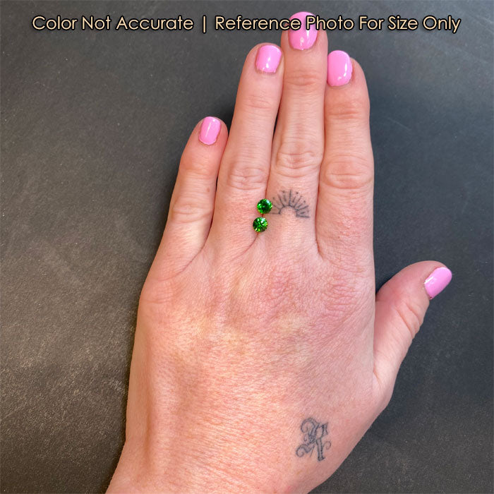 demantoid garnet gems on hand