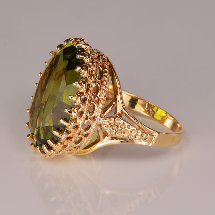 yellow gold and green synthetic spinel ring