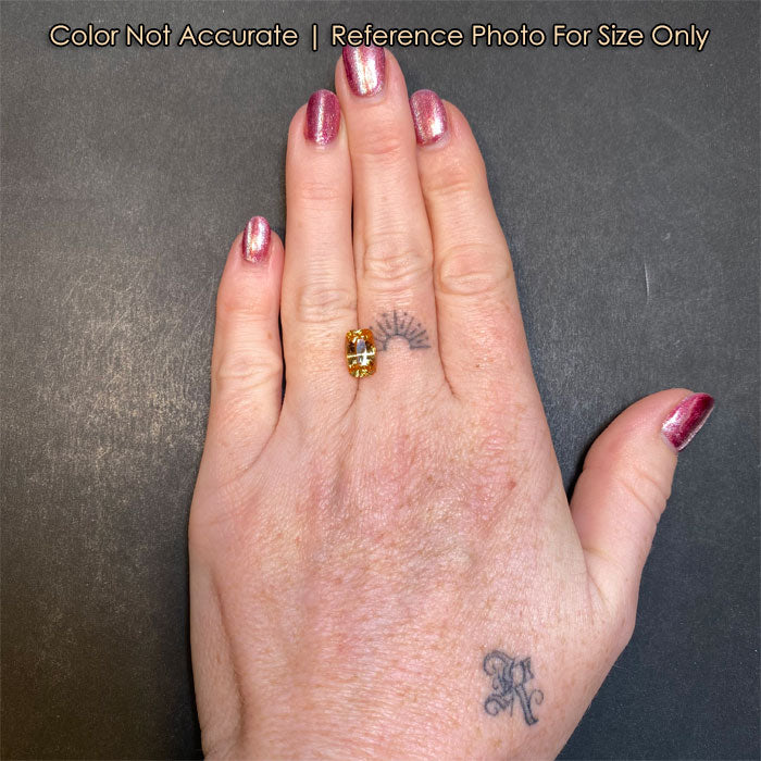 yellow grossular garnet gem on hand