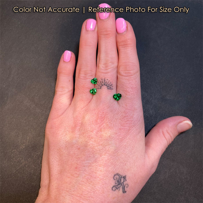 garnet gems on hand heart shaped green color