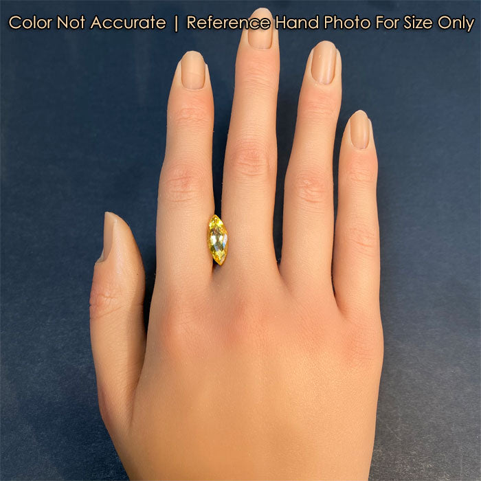 golden beryl gemstone on hand