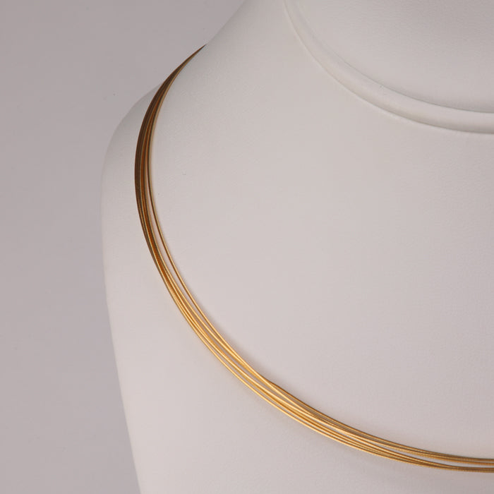 yellow gold cord style seven strand necklace