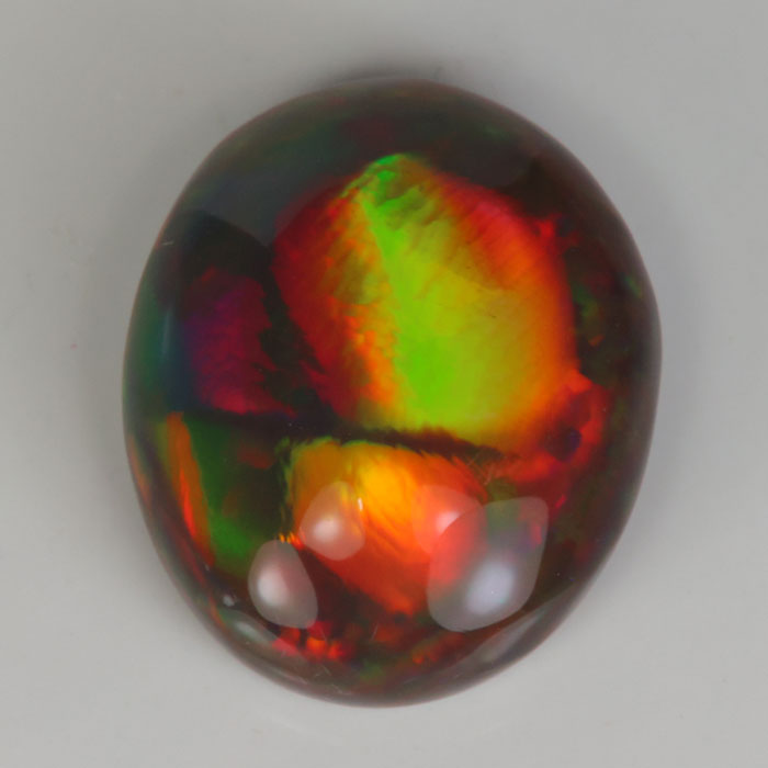oval cut black opal gemstone